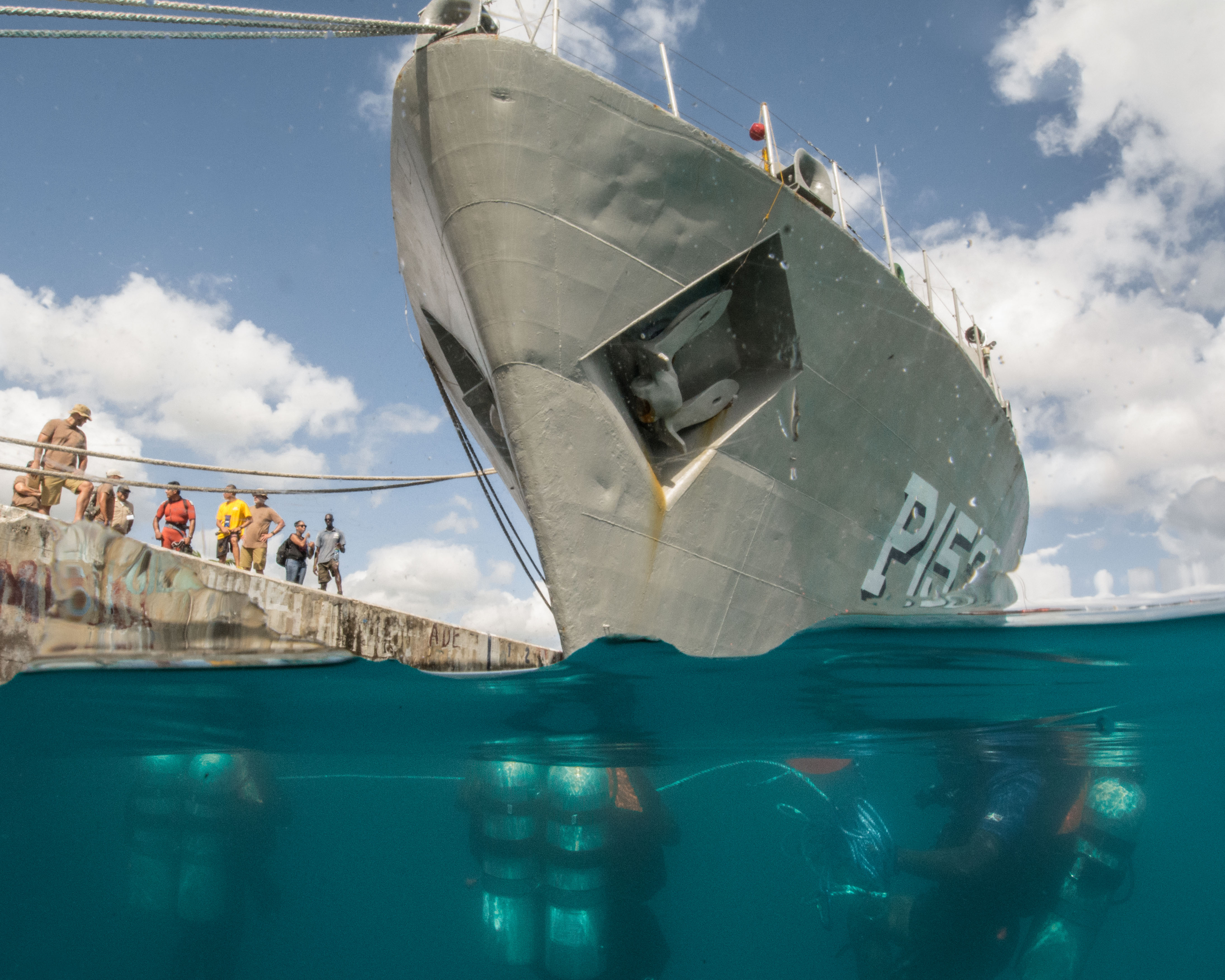 Caribbean divers get in position to conduct a hull search of the Mexican naval ship ARM...
</div>
<a href=